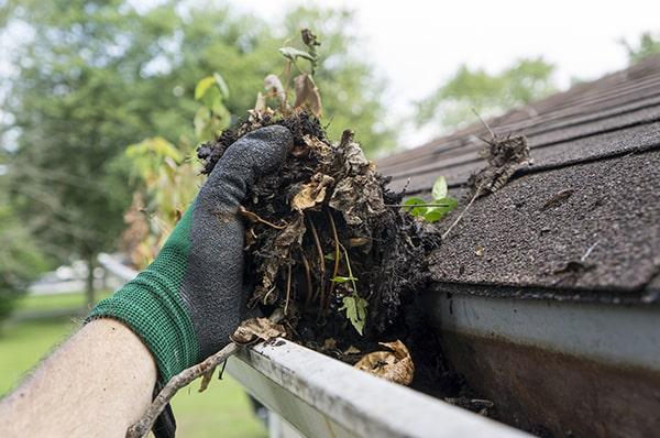 overflowing water, sagging gutters, and visible debris are indicators that it's time for gutter cleaning